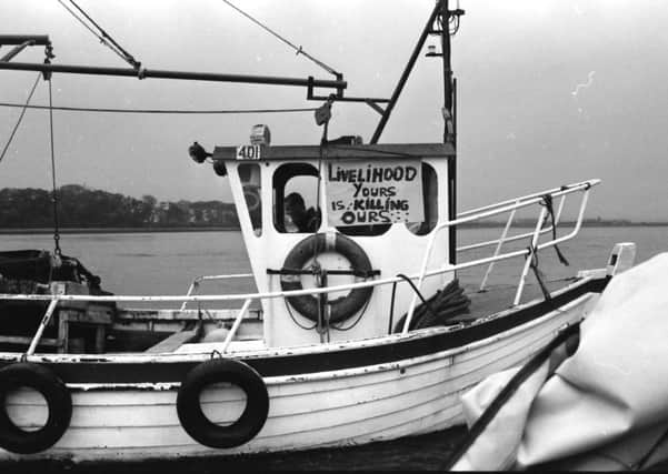 A Lough Foyle fisherman protests after a spillage from DuPont in 1992.
