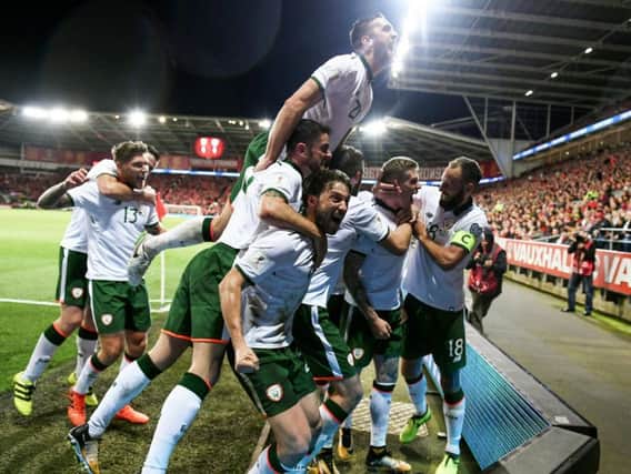 Republic of Ireland players celebrate with Derry man and goalscorer, James McClean, after his goal fired the Boys In Green into the playoffs for the 2018 World Cup finals in Russia. (Photo: Stephen McCarthy/Sportsfile)