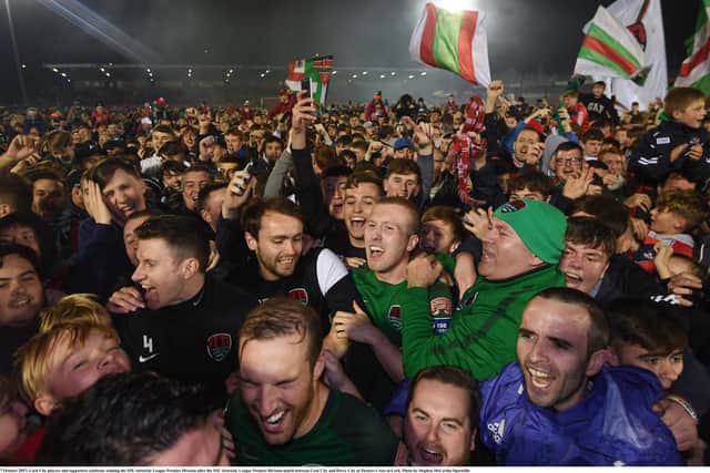 Former Derry City winger, Stephen Dooley is mobbed by Cork City supporters as the Leesiders are finally crowned league champions at Turner's Cross.