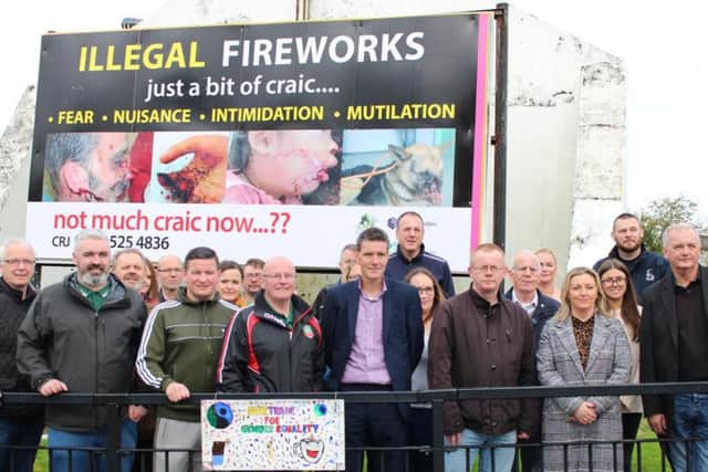 Local councillors and community workers pictured at the launch of the C.R.J. billboard in the Bogside on Tuesday.