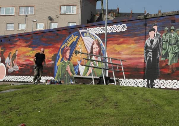 The Cumann na mBan mural at Gartan Square being painted in 2014.
