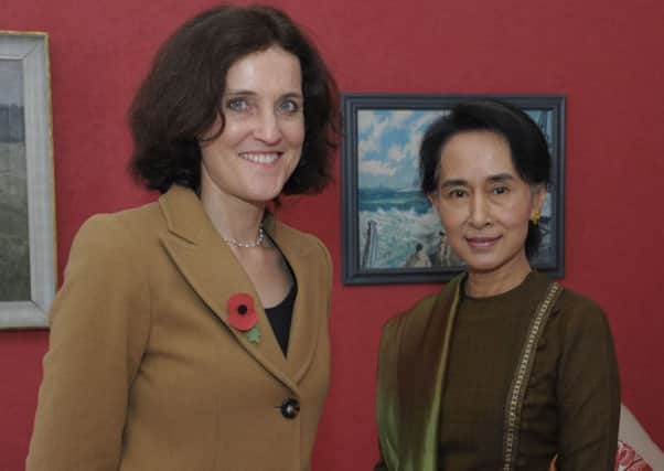 Former Secretary of State Theresa Villiers with Aung San Suu Kyi in 2013.