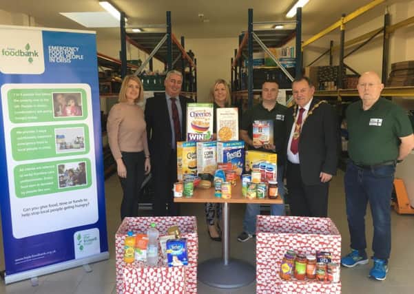 Mayor MaolÃ­osa McHugh pictured with representatives of the Foyle Foodbank as they launch their Christmas Food Drive.