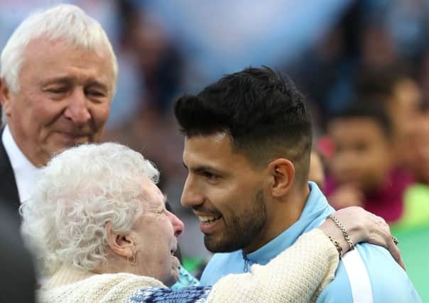 Manchester City's Sergio Aguero receives an award for breaking the club goal scoring record before the Premier League match at the Etihad Stadium, Manchester.