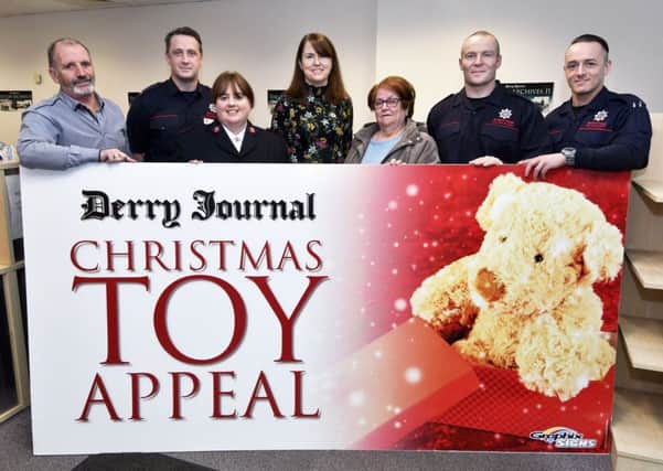 Pictured at the launch of the Derry Journal Christmas Toy Appeal were, from left, Arthur Duffy, Editor of the Derry Journal, Firefighter Darren Duffy, Lieutenant Julia Mapstone, Salvation Army, Geraldine Gallagher, Derry Journal administrator, Ella McCallion, Area Vice-President, St. Vincent de Paul, Firefighter Andrew Eakin and Firefighter Sean McGroarty. DER4617-137KM
